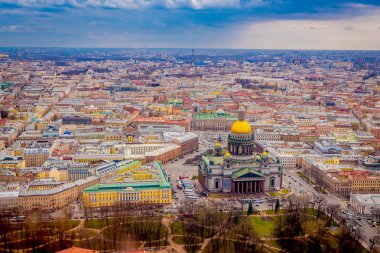 Beautiful aerial view landscape of Saint Isaacs Cathedral surrounding of buildings of the city of St. Petersburg durring a sunny day clipart