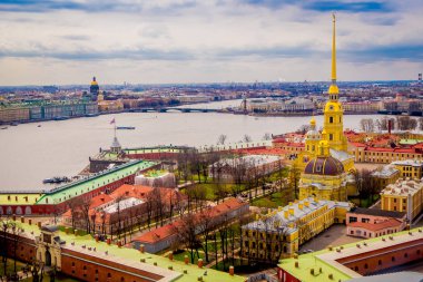 Beautiful above view of Peter and Paul Fortress, surrounding of different buildings in the city of Saint-Petersburg, during a gorgeous sunny day clipart