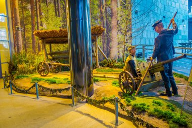 BELARUS, MINSK - MAY 01, 2018: Indoor view of man max wearing a military uniform, in representation of war and equipment used during the war inside of State Museum of the Great Patriotic War in Minsk clipart