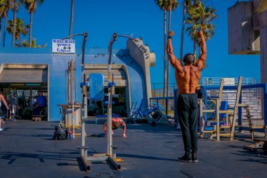 Los Angeles, California, USA, JUNE, 15, 2018: Muscle Beach gym on Venice Beach, muscle Beach is a landmark, outdoor gym dating back to the 1930s where celebrities and famous bodybuilders trained clipart