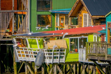 Beautiful coorful houses on stilts palafitos in Castro, Chiloe Island clipart