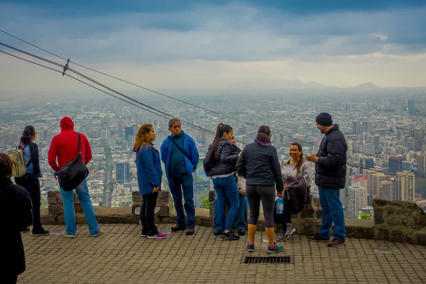 SANTIAGO, CHILE - OCTOBER 16, 2018: Group of tourists enjoying the gorgeous view from Cerro San Cristobal in Santiago de Chile, Chile — Stock Photo, Image