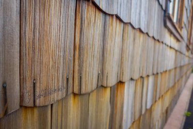 Facade made of larch, texture, Puerto Varas, Chile. Close-up clipart