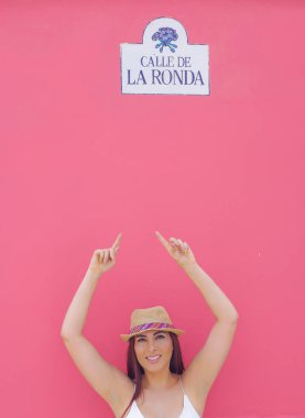 Quito, Ecuador, December, 12 2018: Portrait of beautiful young woman wearing a panama hat at la Ronda street located close to historical center of old town Quito in northern Ecuador clipart