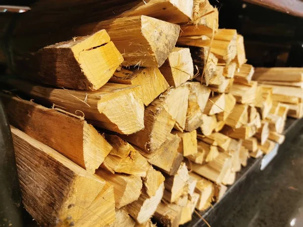 Fire wood stack, selective focus applied, close up. — Stock Photo, Image