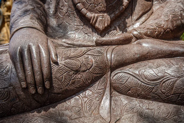 Buddha hands. Stone statue of Sitting Buddha, Bali, Indonesia. Close up.