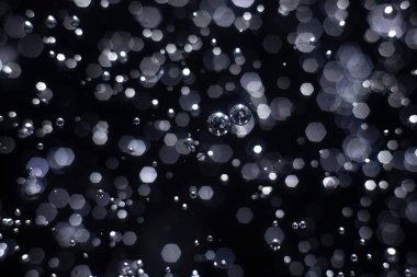 Noellerin soyut ve ışıltılı arka planlı bokeh ışığı .