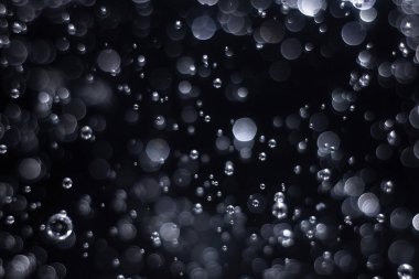 Noellerin soyut ve ışıltılı arka planlı bokeh ışığı .