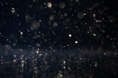 Noellerin soyut ve ışıltılı arka planlı bokeh ışığı .