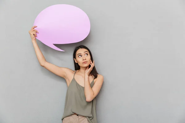 Portrait Pensive Asian Woman Holding Blank Speech Bubble Looking Away — Stock Photo, Image