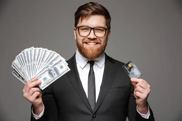 Portrait Happy Young Businessman Holding Money Banknotes Credit Card Isolated — Stock Photo, Image