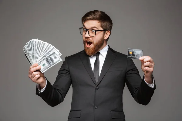 Portrait Surprised Young Businessman Holding Money Banknotes Credit Card Isolated — Stock Photo, Image