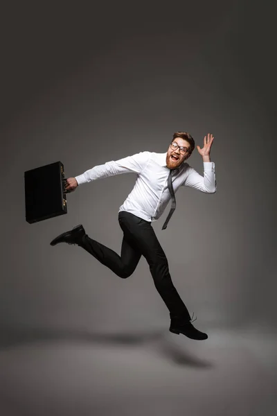 Full Length Portrait Excited Young Businessman Posing While Holding Briefcase — Stock Photo, Image