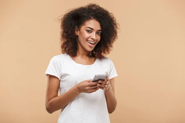 Portrait Pretty Young African Woman Using Mobile Phone Isolated Beige — Stock Photo, Image