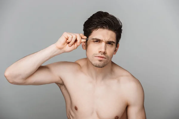 Beauty Portrait Half Naked Focused Young Man Using Tweezers Isolated — Stock Photo, Image