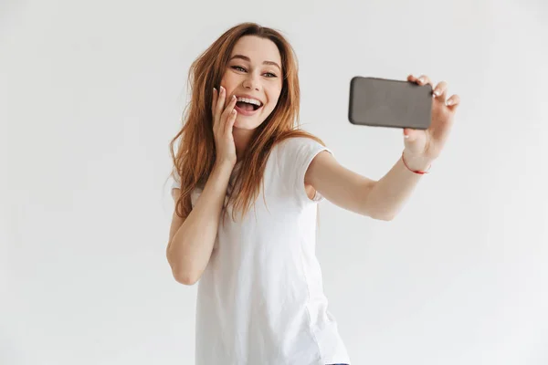 Pleased Woman Casual Clothes Making Selfie Smartphone While Touching Her — Stock Photo, Image