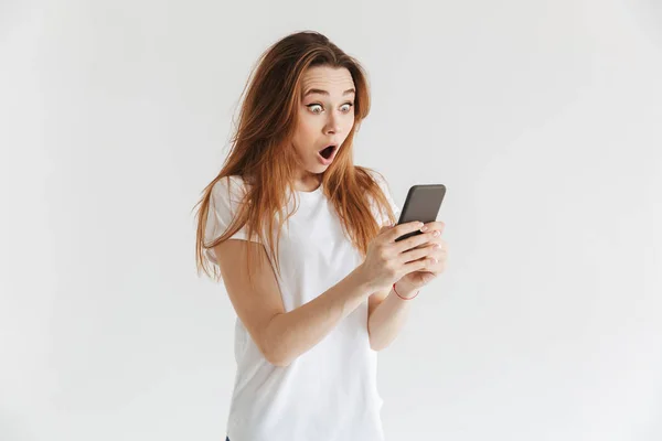 Shocked Woman Casual Clothes Writing Message Smartphone Grey Background — Stock Photo, Image