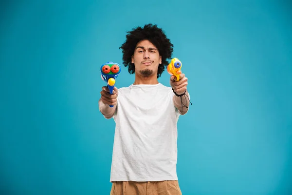 Portrait Happy Young African Man Playing Two Water Guns Isolated — Stock Photo, Image