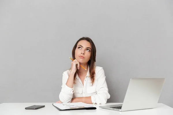 Portrait Pensive Young Business Woman Sitting Office Desk Isolated White — Stock Photo, Image