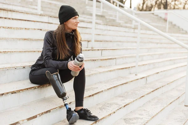 Portrait Attractive Handicapped Woman Black Tracksuit Prosthetic Leg Sitting Street — Stock Photo, Image