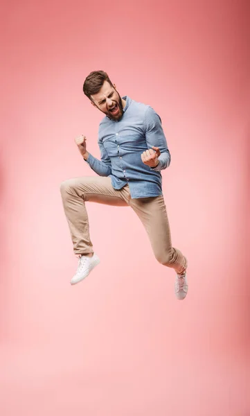Full Length Satisfied Young Man Jumping Celebrating Success Isolated Pink — Stock Photo, Image