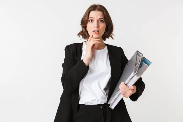 Portrait Puzzled Young Businesswoman Dressed Black Jacket Holding Folders Isolated — Stock Photo, Image
