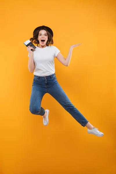 Image Excited Emotional Young Woman Tourist Jumping Isolated Yellow Background — Stock Photo, Image