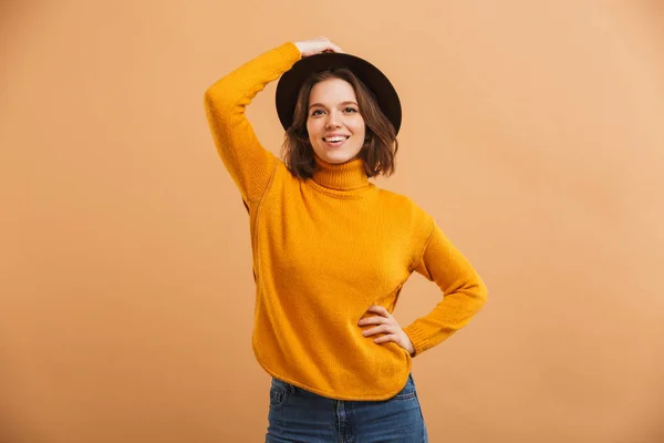 Image of happy young woman standing isolated looking camera.