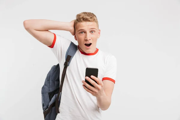 Portrait Excited Teenage Boy Standing Backpack Holding Mobile Phone Isolated — Stock Photo, Image