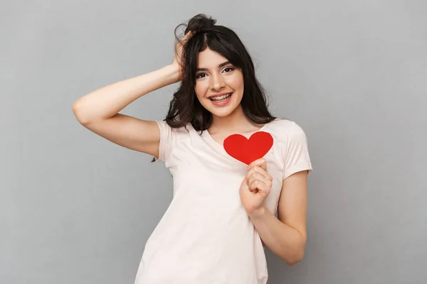 Image Happy Young Lady Holding Heart Isolated Grey Background Wall — Stock Photo, Image