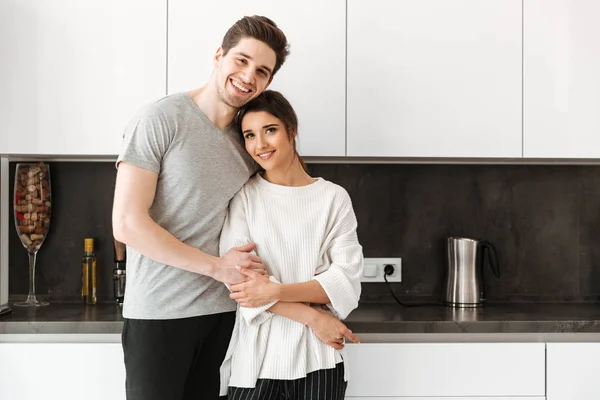 Portrait Lovely Young Couple Hugging While Standing Kitchen Home — Stock Photo, Image