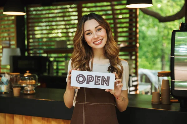 Portrait Smiling Young Barista Girl Apron Holding Open Sign Board — Stock Photo, Image