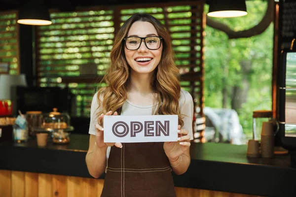 Portrait Laughing Young Barista Girl Apron Holding Open Sign Board — Stock Photo, Image