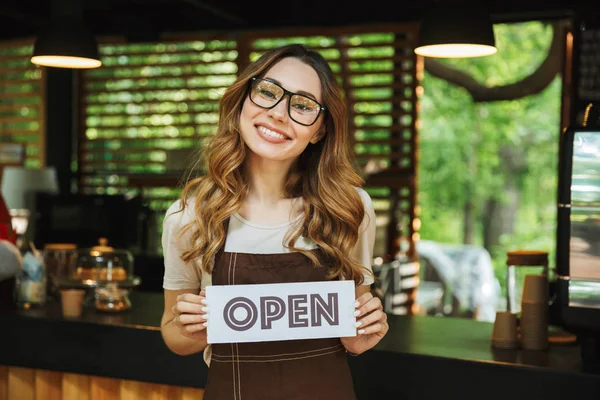 Portrait Pretty Young Barista Girl Apron Holding Open Sign Board — Stock Photo, Image