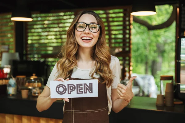 Portrait Smiling Young Barista Girl Apron Holding Open Sign Board — Stock Photo, Image