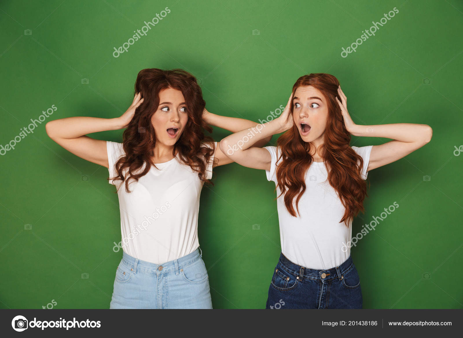 Portrait Two Scared Uptight Women Red Hair White Shirts Looking