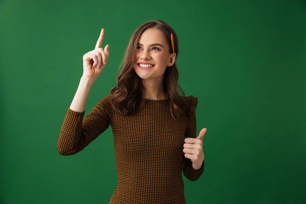 Image Cheerful Young Woman Standing Isolated Green Background Pointing Make — Stock Photo, Image