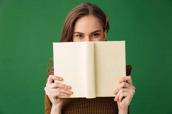 Image Young Woman Standing Isolated Green Background Holding Book Covering — Stock Photo, Image