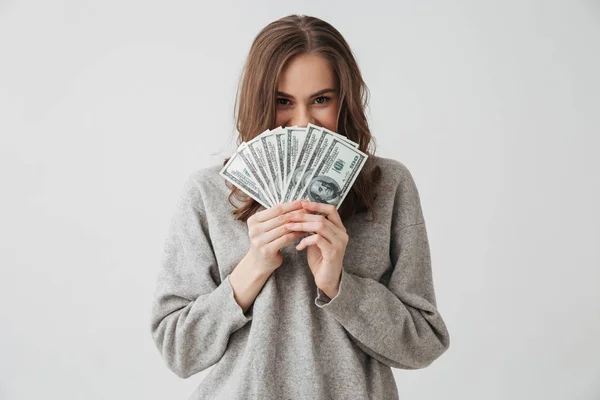 Smiling Sly Brunette Woman Sweater Hiding Money Looking Camera Grey — Stock Photo, Image
