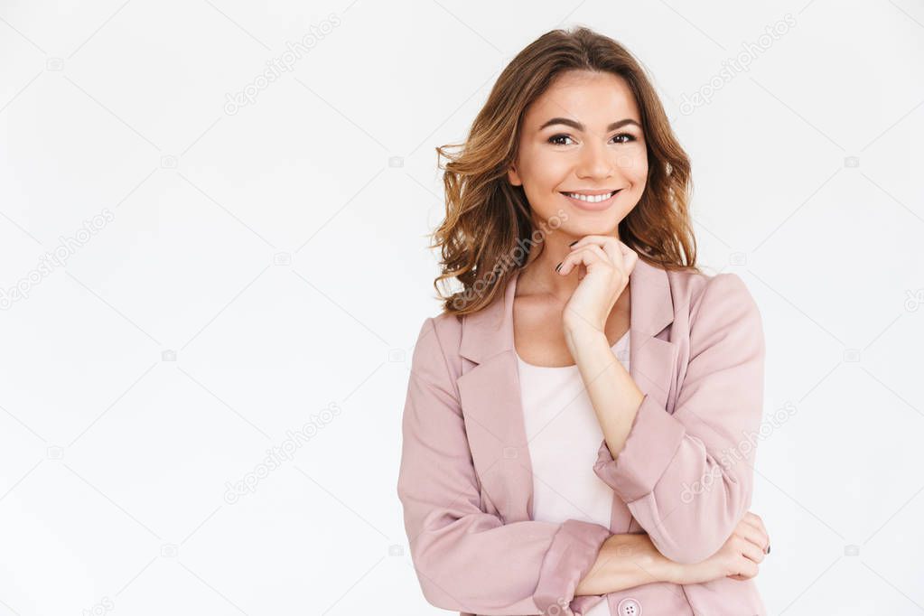 Image of amazing young pretty woman standing isolated over white wall background looking camera.