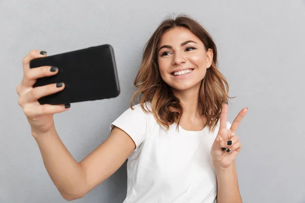 Close Portrait Smiling Young Woman Taking Selfie Gray Background — Stock Photo, Image