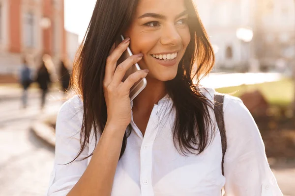 Close Image Cheerful Brunette Woman Shirt Talking Smartphone Looking Away — Stock Photo, Image