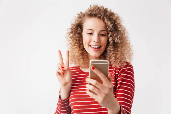 Portrait Cheerful Young Girl Curly Hair Waving Mobile Phone Isolated — Stock Photo, Image