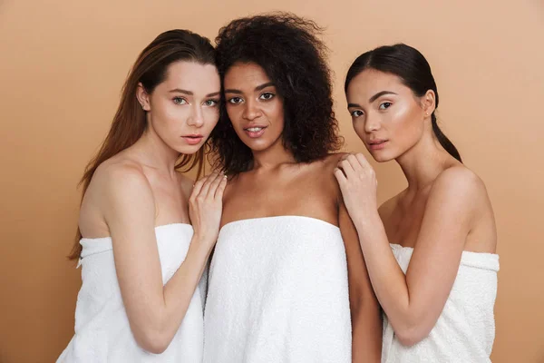 Three Young Women Wearing Towels Posing Together Looking Camera Beige — Stock Photo, Image