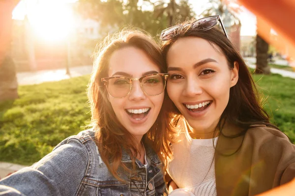 Photo Two Young Cute Funny Women Friends Outdoors Park Make — Stock Photo, Image