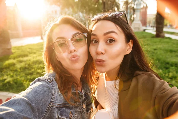 Photo Two Young Cute Funny Women Friends Outdoors Park Make — Stock Photo, Image