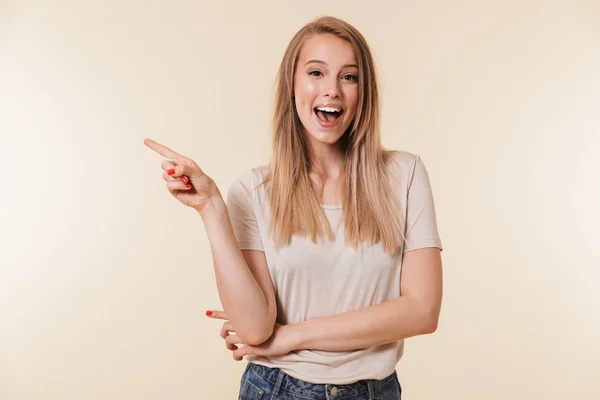 Portrait Smiling Casual Girl Pointing Finger Away Copy Space Isolated — Stock Photo, Image