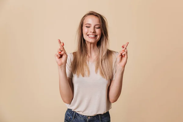 Portrait Smiling Casual Girl Holding Fingers Crossed Good Luck Isolated — Stock Photo, Image