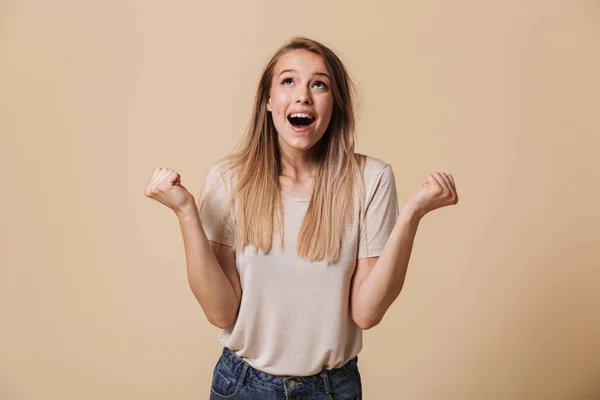 Portrait Satisfied Casual Girl Celebrating Success Isolated Beige Background — Stock Photo, Image