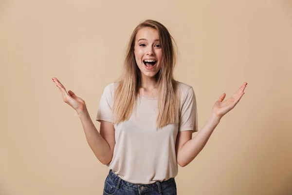Portrait Cheerful Casual Girl Celebrating Success Open Mouth Isolated Beige — Stock Photo, Image